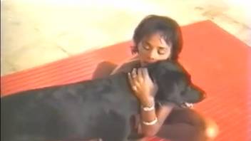 Tanned Latin woman enthusiastically mounting a canine's member