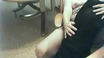 Older woman pleasures herself while the dog is nearby to lick her