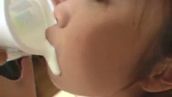 Asian chick pressing her mouth against a pooch's delicate dick