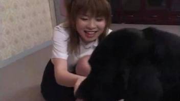 Good-looking Japanese teen fucks a kinky black dog