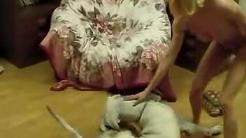 Excited blonde fully engages with her dog's penis