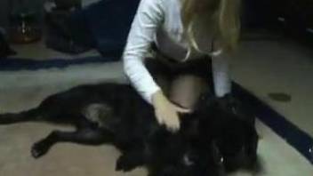 Sexy blonde woman loves making out with the dog by sucking its dick