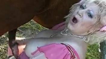 Voluptuous older woman with plump curves and enormous breasts, authentic bestiality