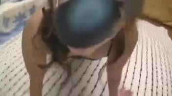 Asian woman filmed when deepthroating a pink dog penis