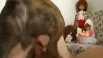 Filthy woman being screwed by a canine and a guy