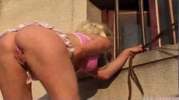 Golden-haired woman with a steamy slit getting playful with a stallion