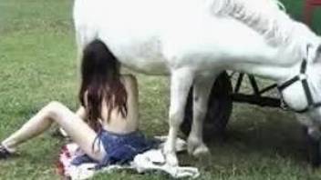 Skinny redheaded zoophile worships a horse's hot cock