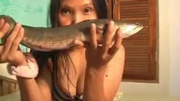 Philippine whore takes it in the ass with a fish during homemade adult webcam fun